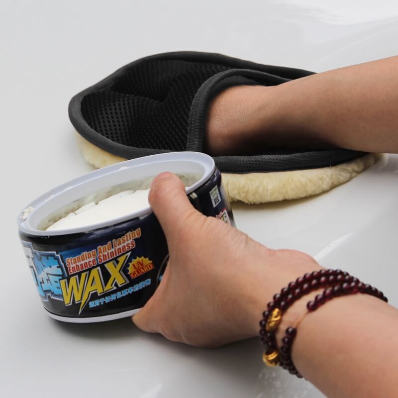 Car Washing Glove on hand applying wax to car